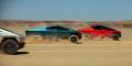red white and blue cybertrucks racing on the desert